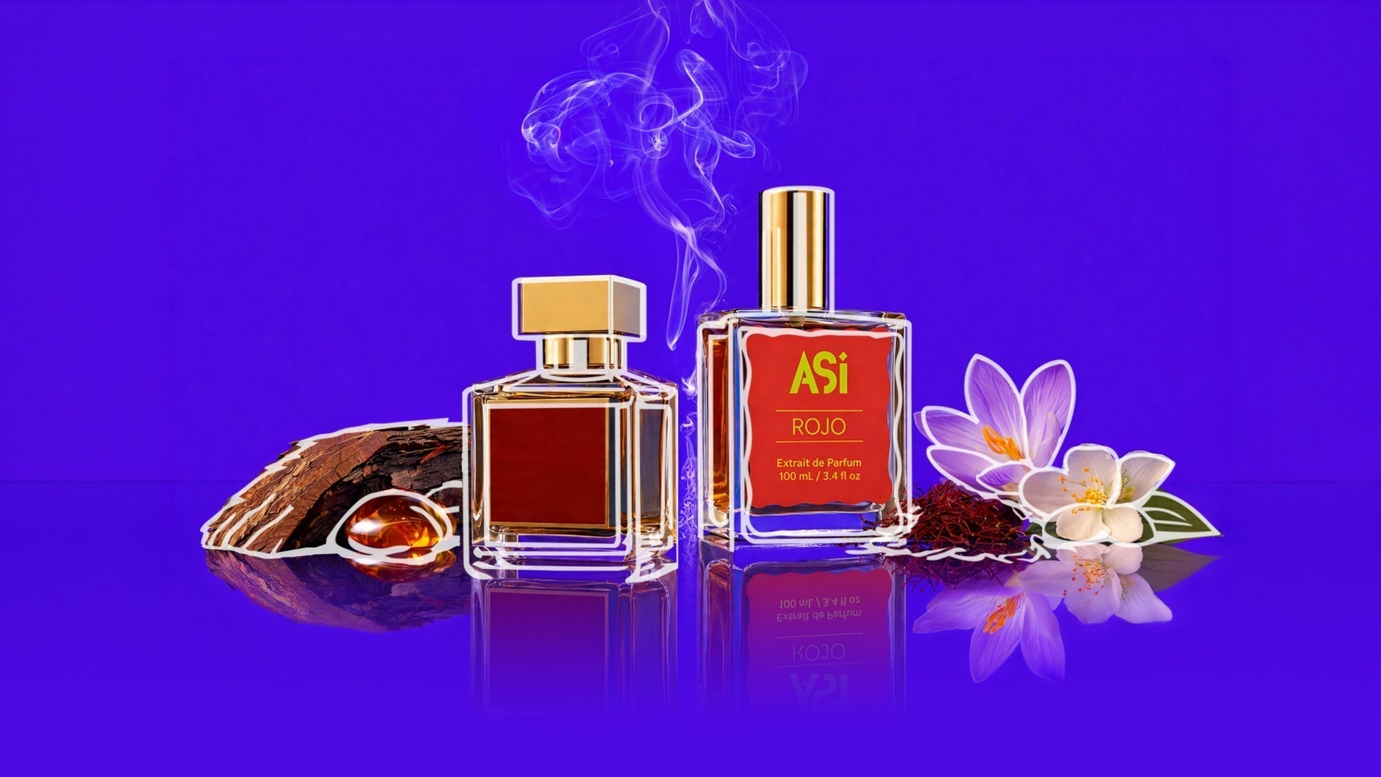 Two glass perfume bottles with gold caps labeled “Así Rojo, Extrait de Parfum 100 mL / 3.4 fl oz,” surrounded by saffron threads, resin, and white-purple flowers on a reflective surface, with wisps of smoke against a vivid purple background.